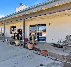 21780 Valley View Road Madera, CA 93638 - Photo 21 of 22 a living room with furniture a window and gym equipment