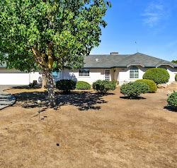 21780 Valley View Road Madera, CA 93638 - Photo 22 of 22 a front view of a house with a yard