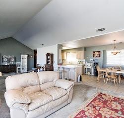 21780 Valley View Road Madera, CA 93638 - Photo 4 of 22 a living room with furniture a dining table and a fireplace