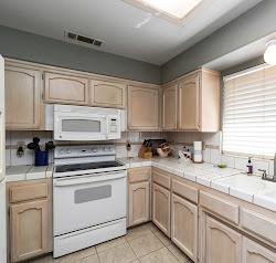 21780 Valley View Road Madera, CA 93638 - Photo 9 of 22 a kitchen with cabinets appliances a sink and a window