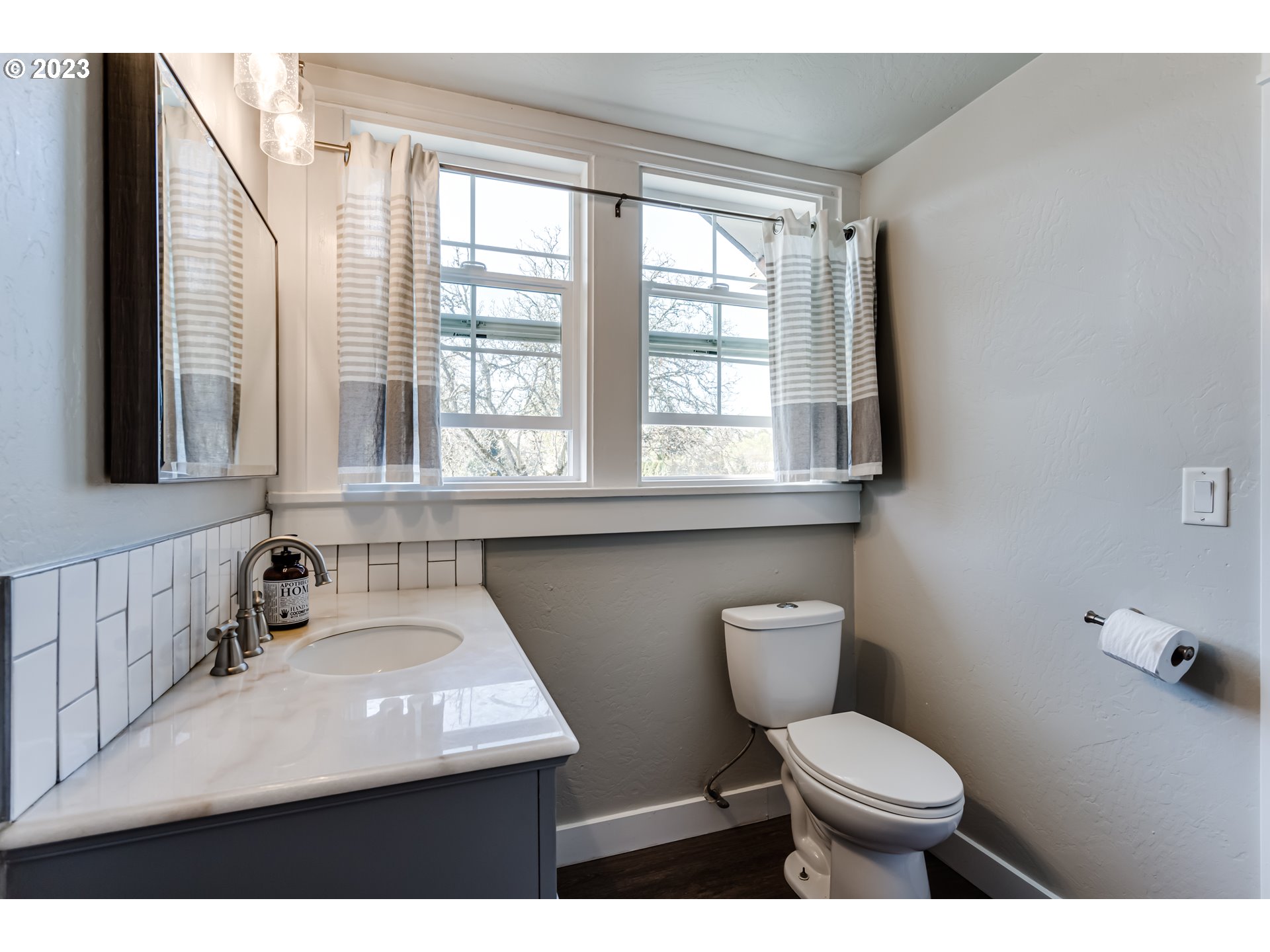 1163 Laurel Avenue Springfield, OR 97478 - Photo 34 of 44 a bathroom with a toilet a sink and a window