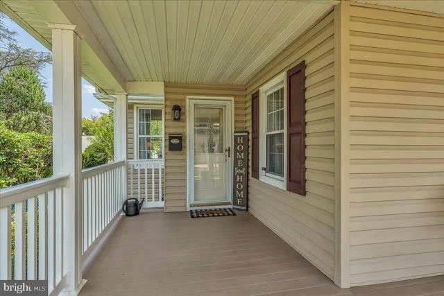 a view of a porch with wooden floor and roof