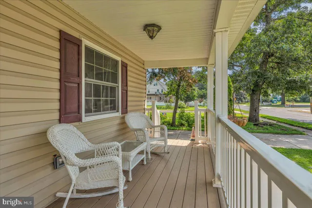 a view of deck with furniture and garden