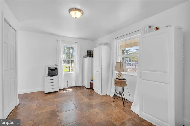 a view of a room with furniture and closet