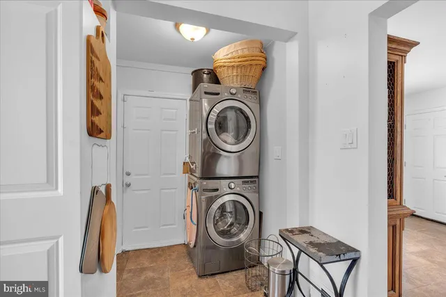 a view of storage and utility room with washer and dryer