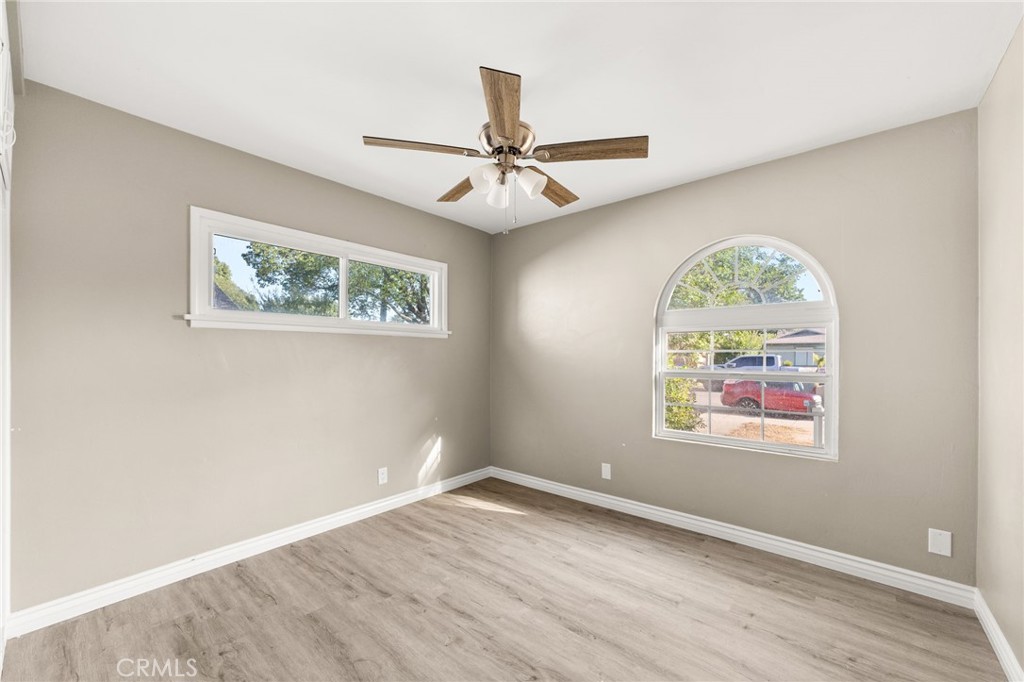 3869 Shamrock Avenue Riverside, CA 92501 - Photo 15 of 34 an empty room with a window and ceiling fan