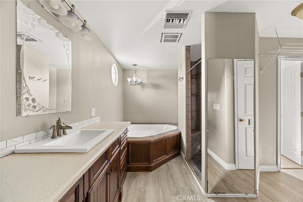 3869 Shamrock Avenue Riverside, CA 92501 - Photo 19 of 34 a bathroom with a sink and a mirror