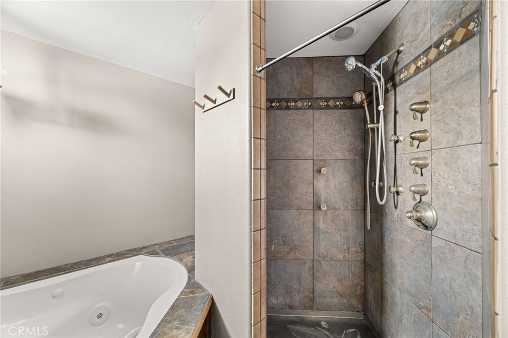 3869 Shamrock Avenue Riverside, CA 92501 - Photo 20 of 34 a bathroom with a bathtub and shower
