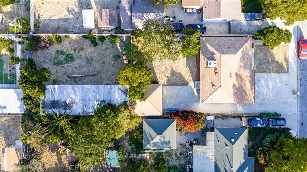 3869 Shamrock Avenue Riverside, CA 92501 - Photo 2 of 34 an aerial view of a house with a garden and trees