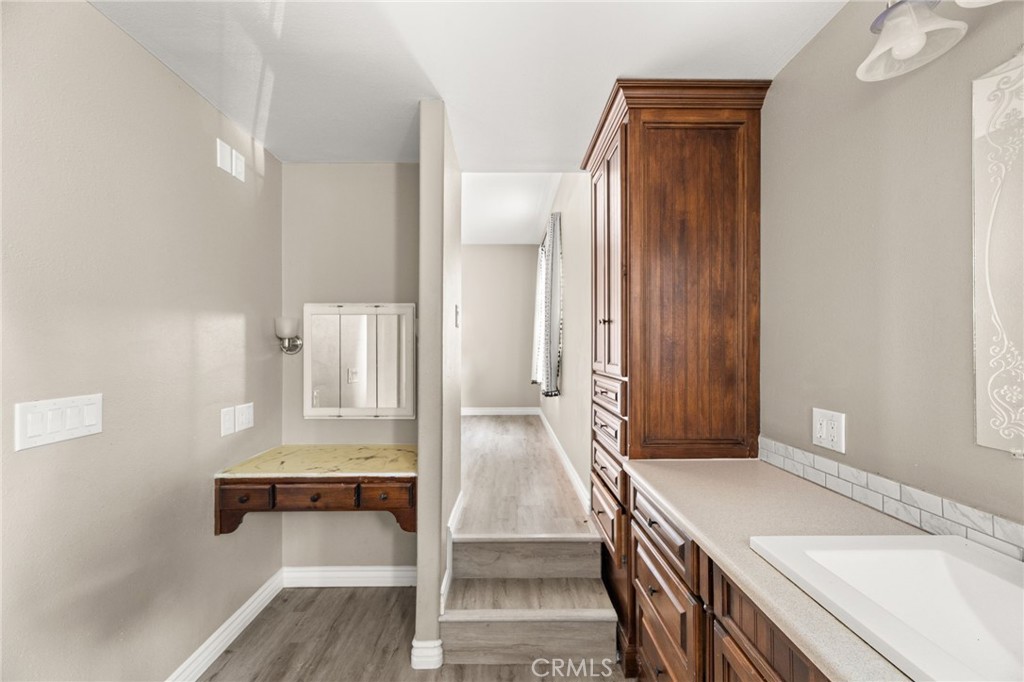 3869 Shamrock Avenue Riverside, CA 92501 - Photo 21 of 34 a view of bathroom with bathtub and wooden floor