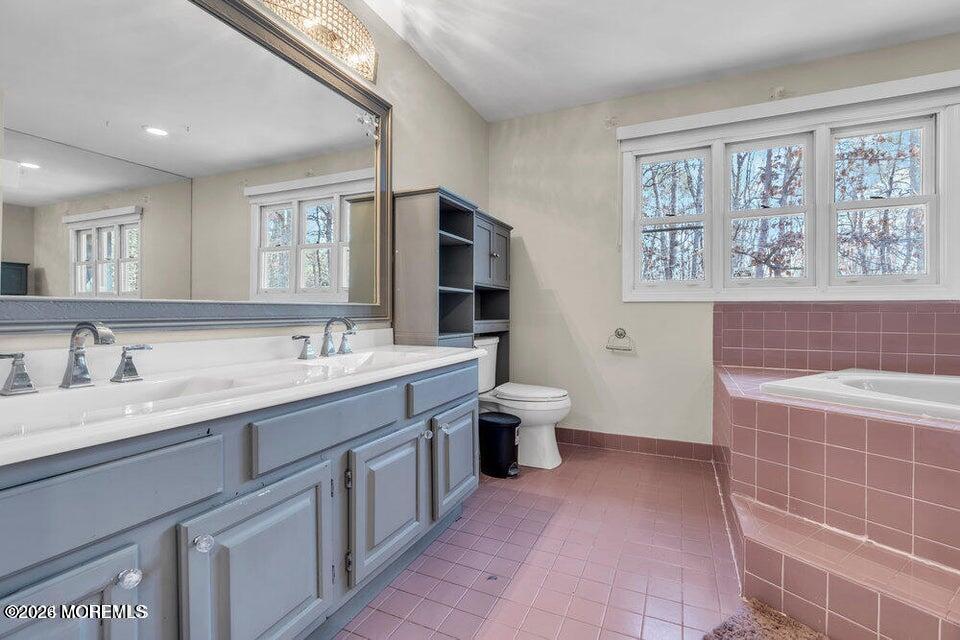 60 Bowman Road Jackson, NJ 08527 - Photo 11 of 68 a spacious bathroom with a granite countertop sink a toilet and a mirror