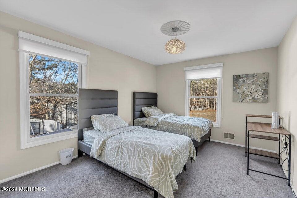 60 Bowman Road Jackson, NJ 08527 - Photo 17 of 68 a bedroom with a bed and a large window