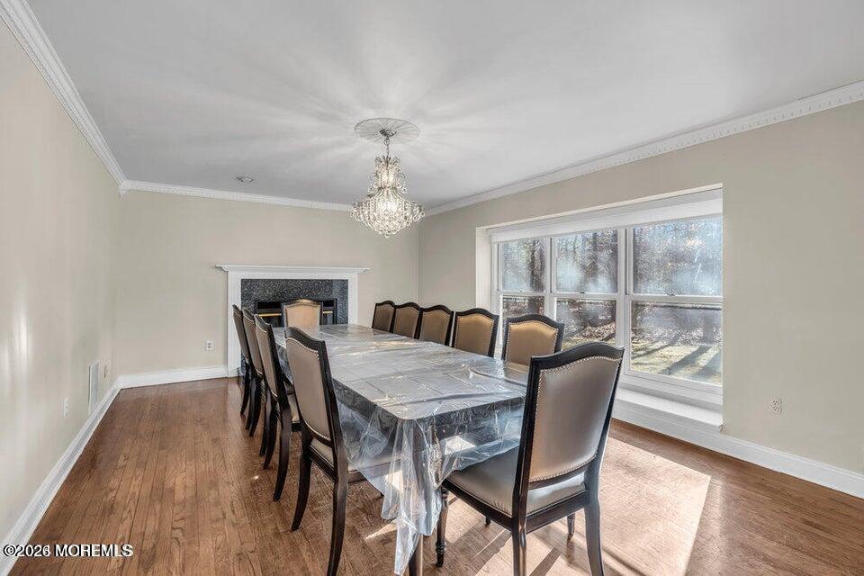60 Bowman Road Jackson, NJ 08527 - Photo 2 of 68 a view of a dining room with furniture window and wooden floor