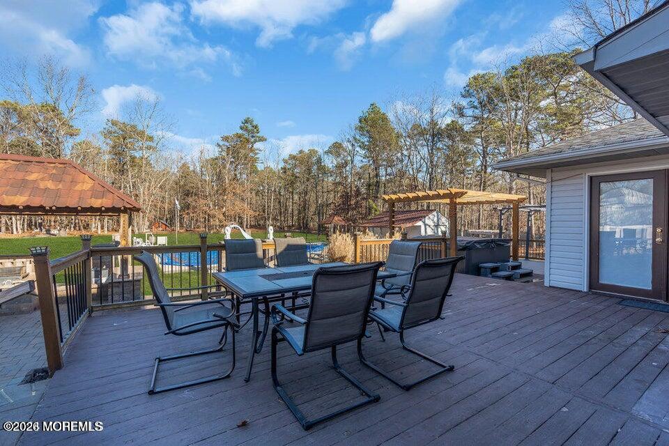 60 Bowman Road Jackson, NJ 08527 - Photo 22 of 68 a view of a chairs and table on the deck
