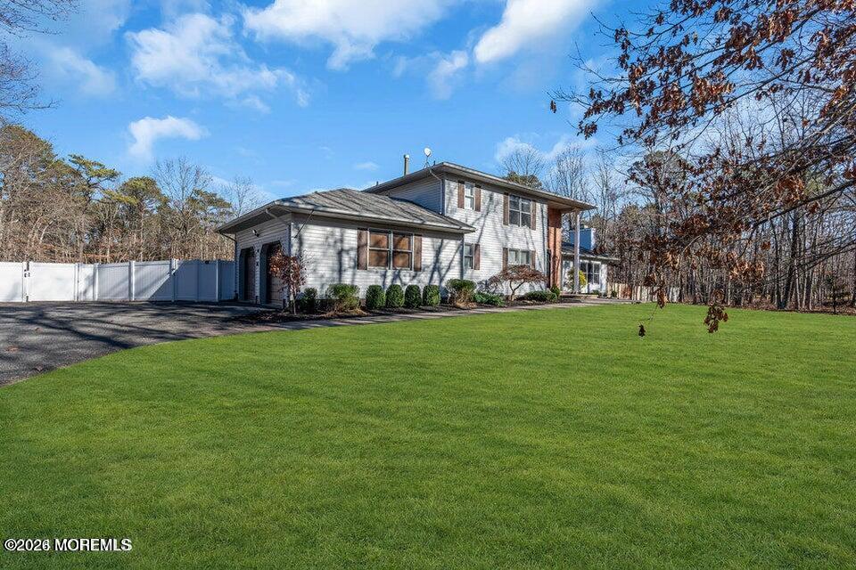 60 Bowman Road Jackson, NJ 08527 - Photo 30 of 68 a front view of a house with a garden