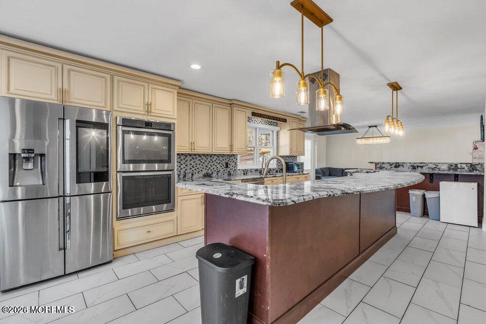 60 Bowman Road Jackson, NJ 08527 - Photo 38 of 68 a kitchen with stainless steel appliances granite countertop a sink a stove and a refrigerator