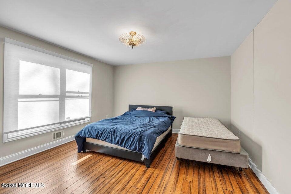 60 Bowman Road Jackson, NJ 08527 - Photo 44 of 68 a living room with a bed furniture and a large window