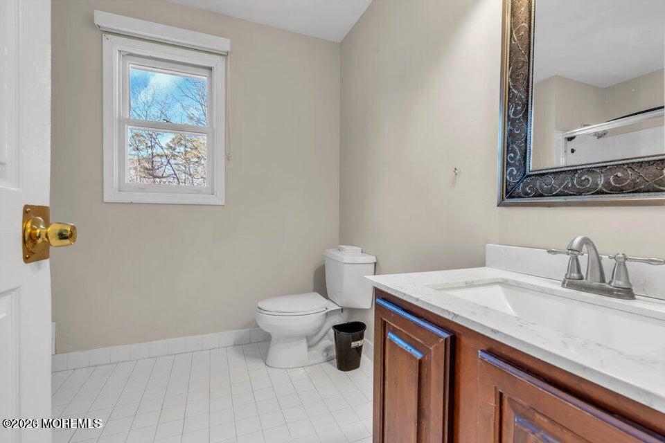 60 Bowman Road Jackson, NJ 08527 - Photo 46 of 68 a bathroom with a granite countertop toilet sink and mirror