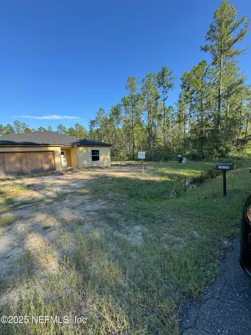 a view of an empty room with a balcony