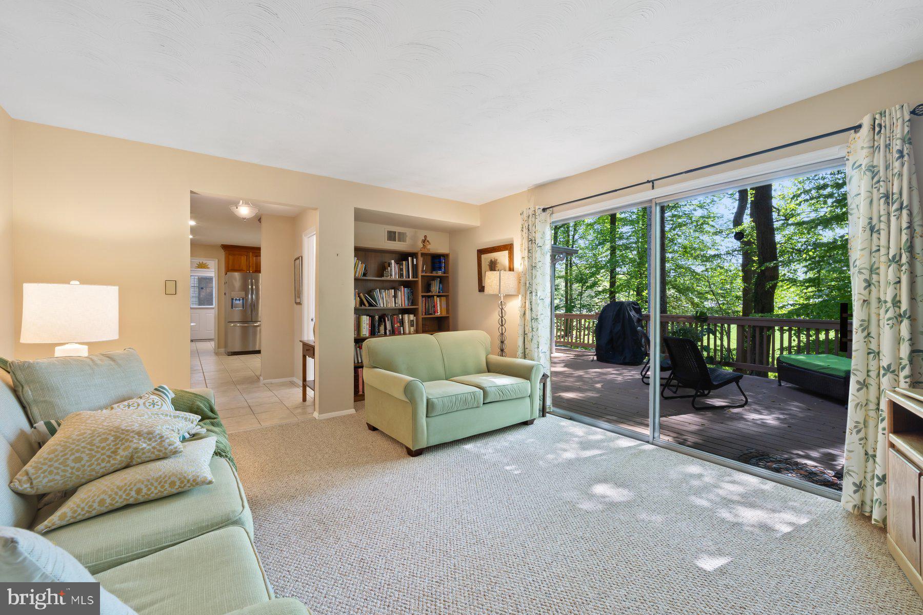 13820 Flint Rock Road Rockville, MD 20853 - Photo 12 of 50 a living room with furniture and a floor to ceiling window