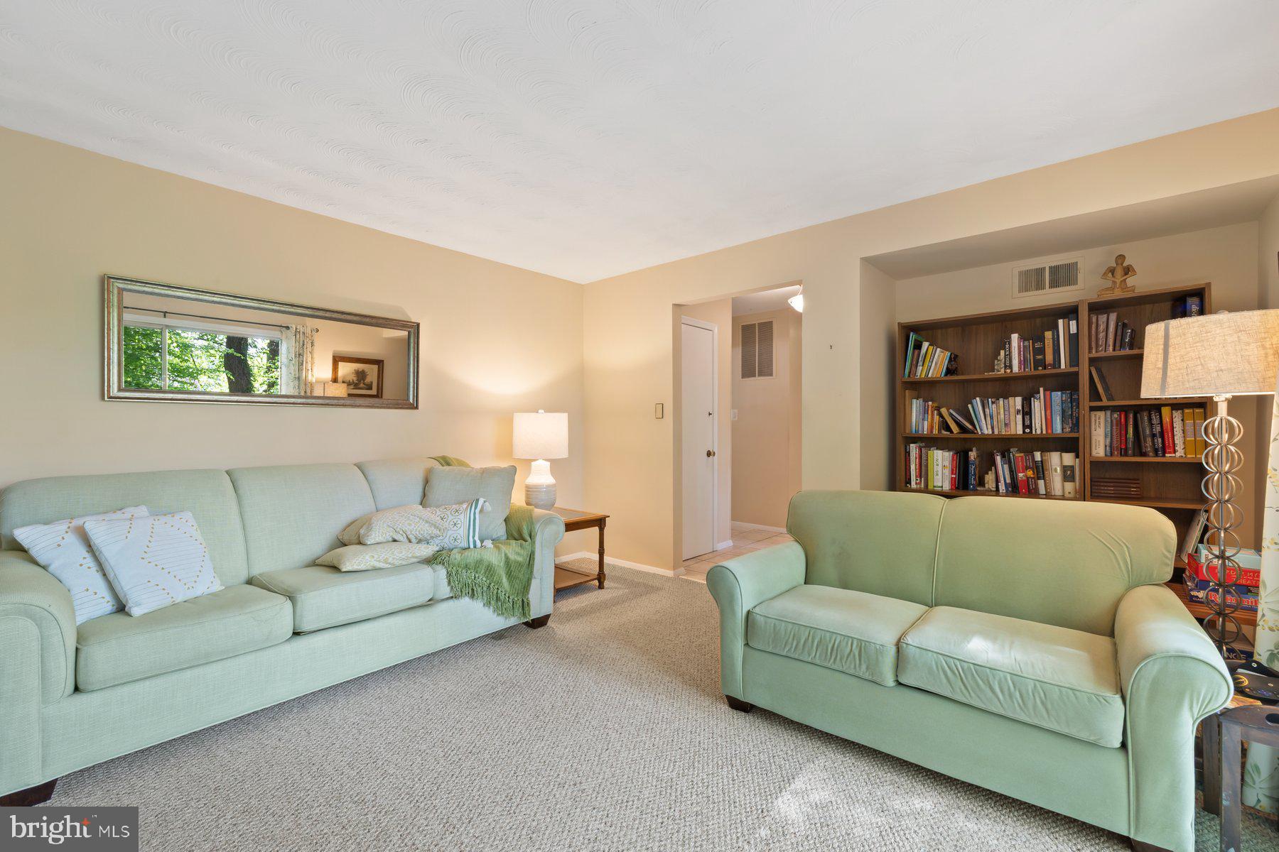 13820 Flint Rock Road Rockville, MD 20853 - Photo 13 of 50 a living room with furniture and a couch