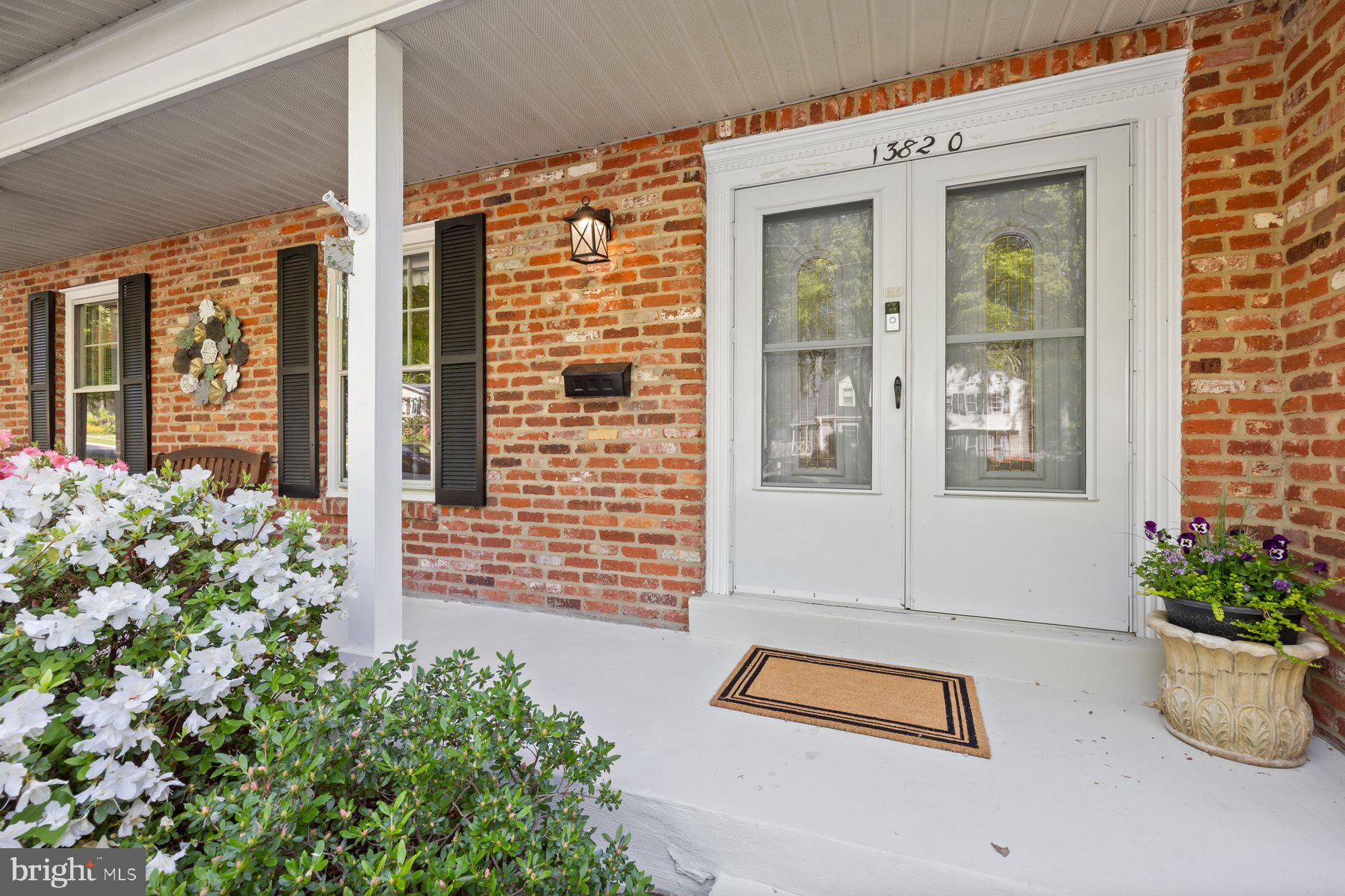 13820 Flint Rock Road Rockville, MD 20853 - Photo 2 of 50 front view of a house with potted plants