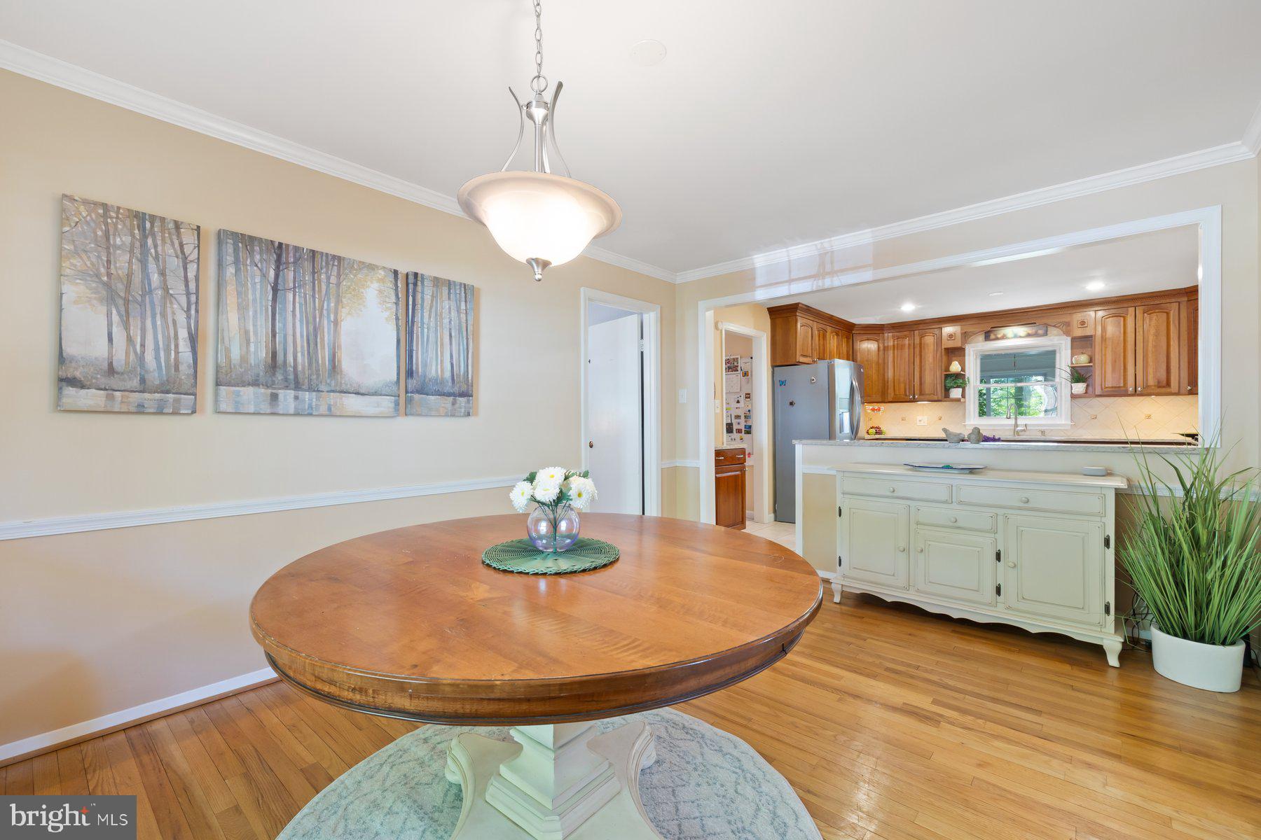 13820 Flint Rock Road Rockville, MD 20853 - Photo 22 of 50 a view of a dining room with furniture and wooden floor