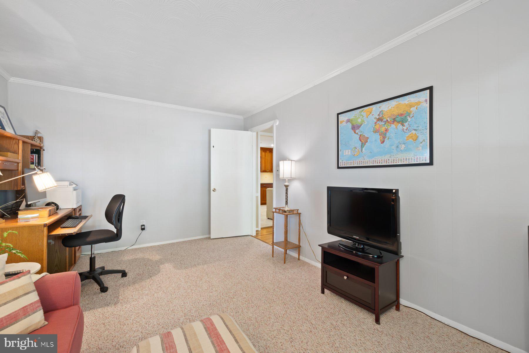 13820 Flint Rock Road Rockville, MD 20853 - Photo 25 of 50 a view of a workspace with furniture and a flat screen tv