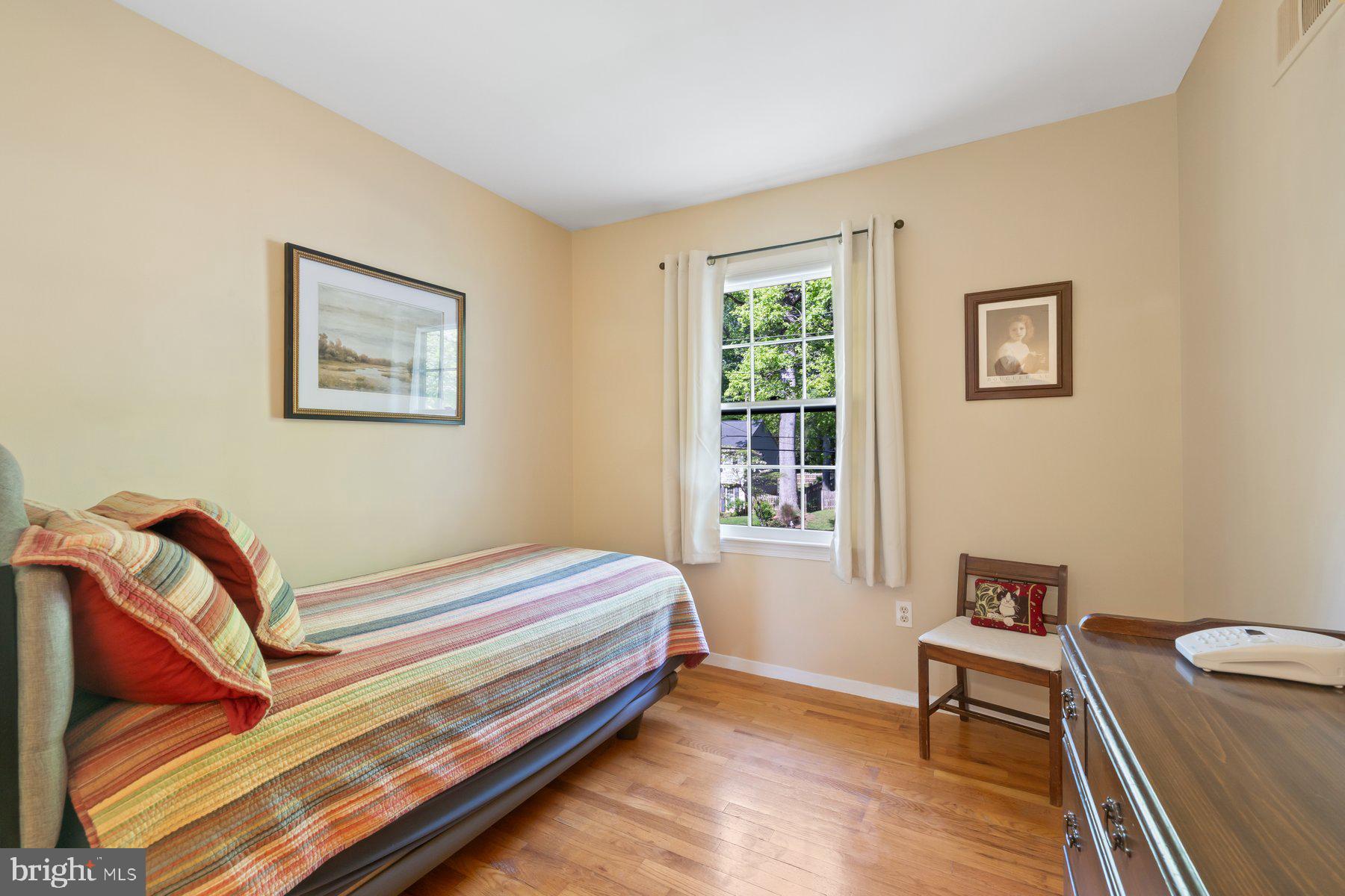 13820 Flint Rock Road Rockville, MD 20853 - Photo 28 of 50 a bedroom with a bed and a window