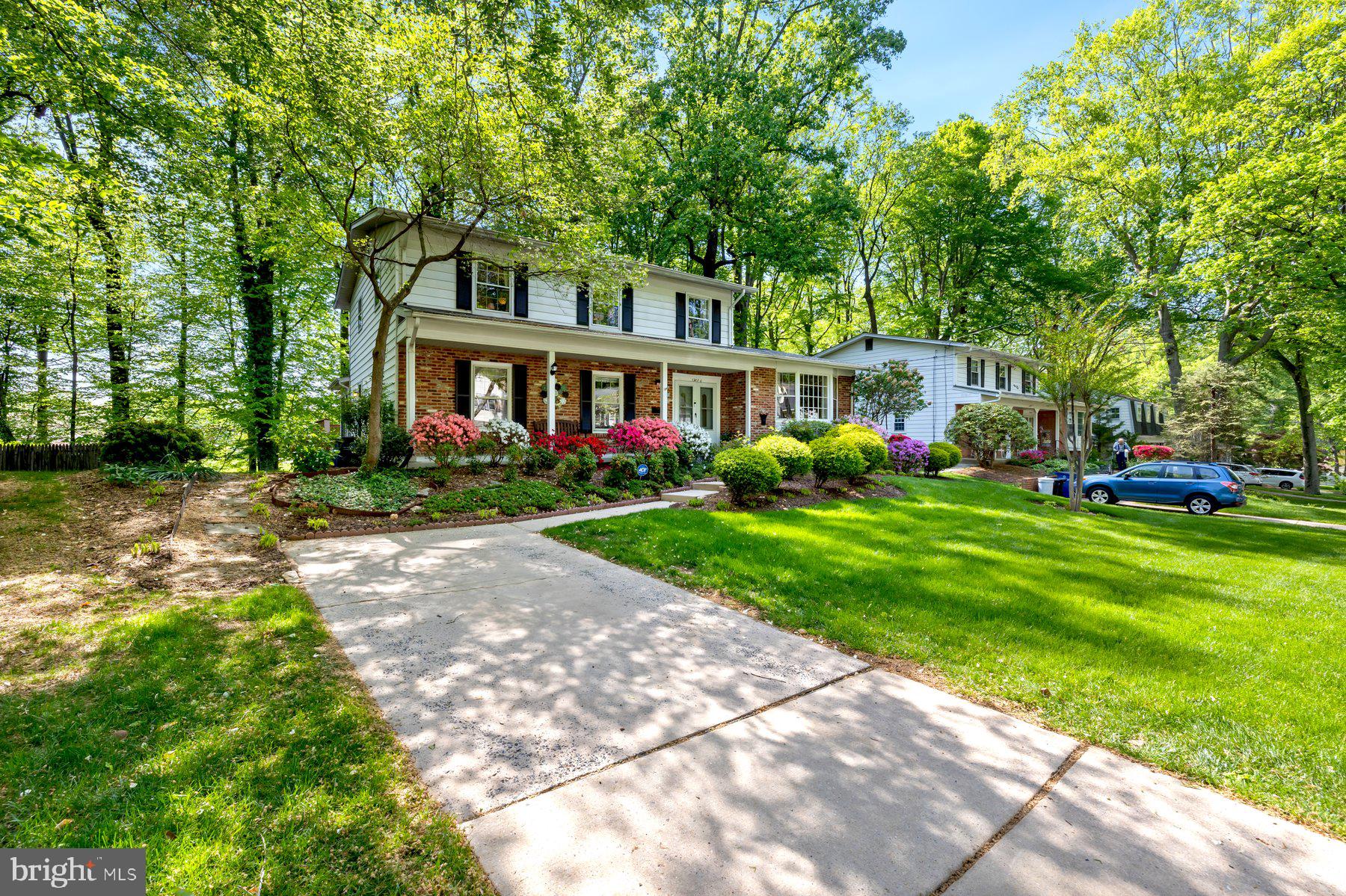 13820 Flint Rock Road Rockville, MD 20853 - Photo 3 of 50 a front view of a house with garden