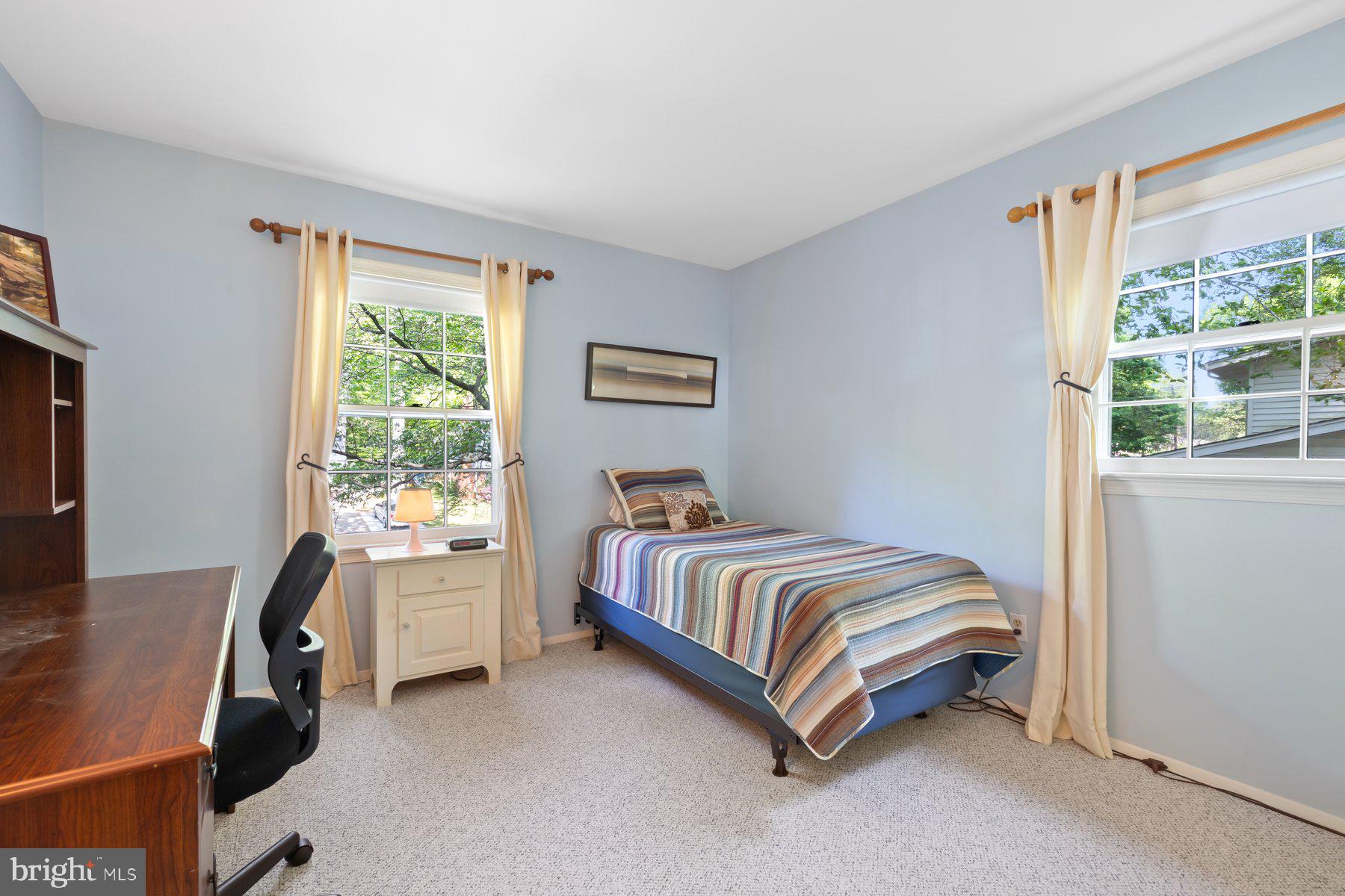 13820 Flint Rock Road Rockville, MD 20853 - Photo 32 of 50 a spacious bedroom with a bed and a window