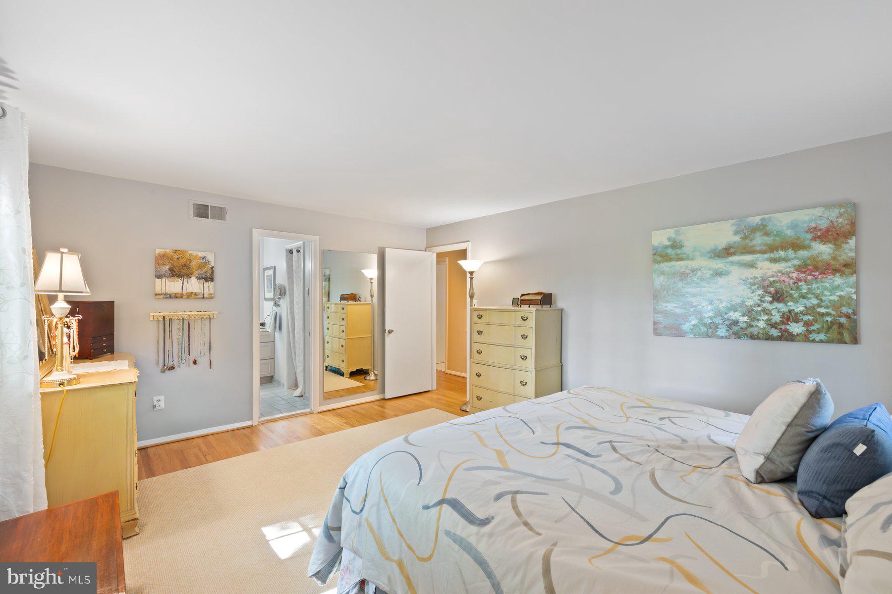 13820 Flint Rock Road Rockville, MD 20853 - Photo 36 of 50 a bedroom with a bed and a cabinets