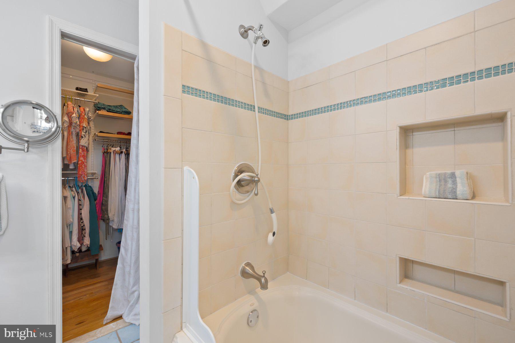 13820 Flint Rock Road Rockville, MD 20853 - Photo 38 of 50 a bathroom with a tub and shower