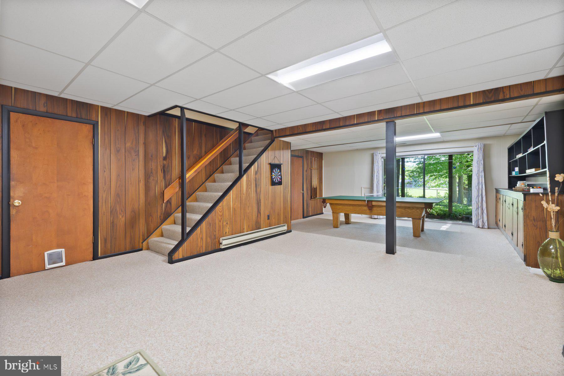 13820 Flint Rock Road Rockville, MD 20853 - Photo 39 of 50 a view of an empty room with wooden floor and furniture