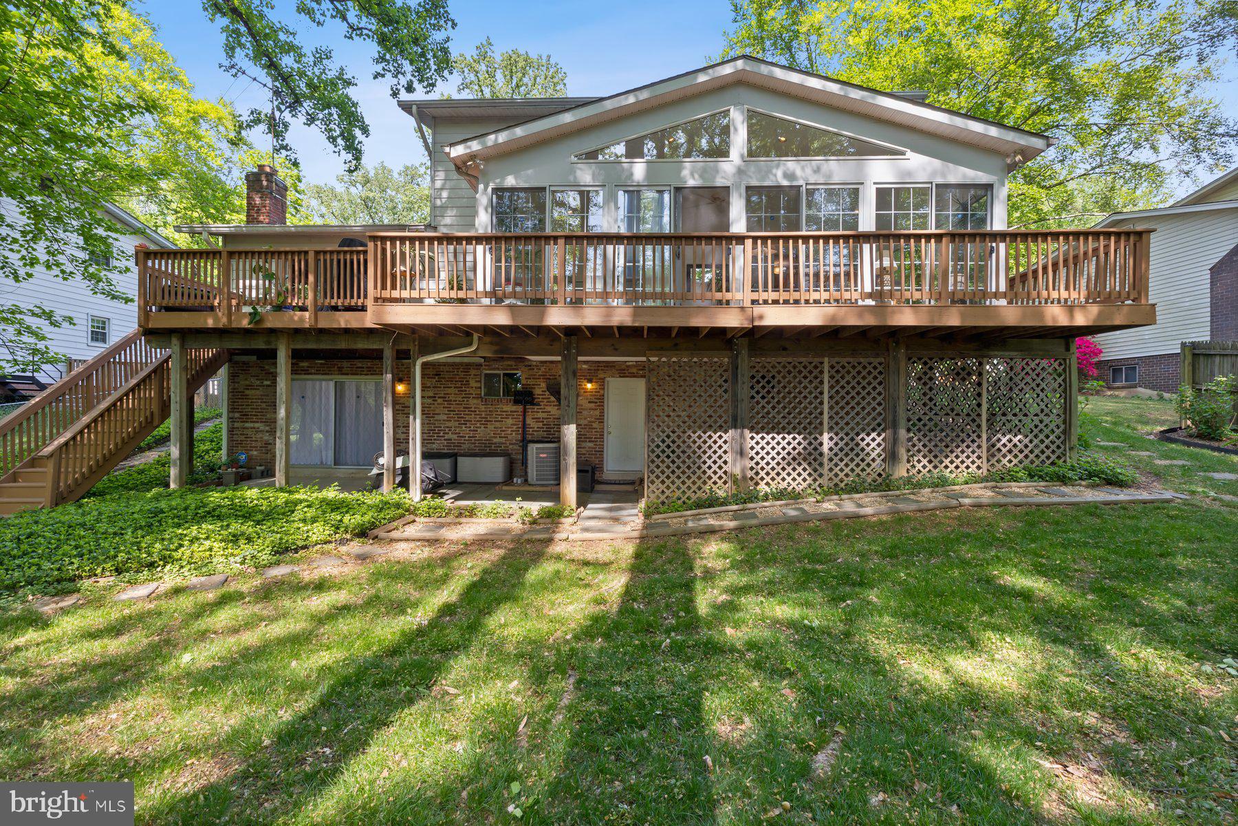 13820 Flint Rock Road Rockville, MD 20853 - Photo 45 of 50 a front view of a house with a garden and lake