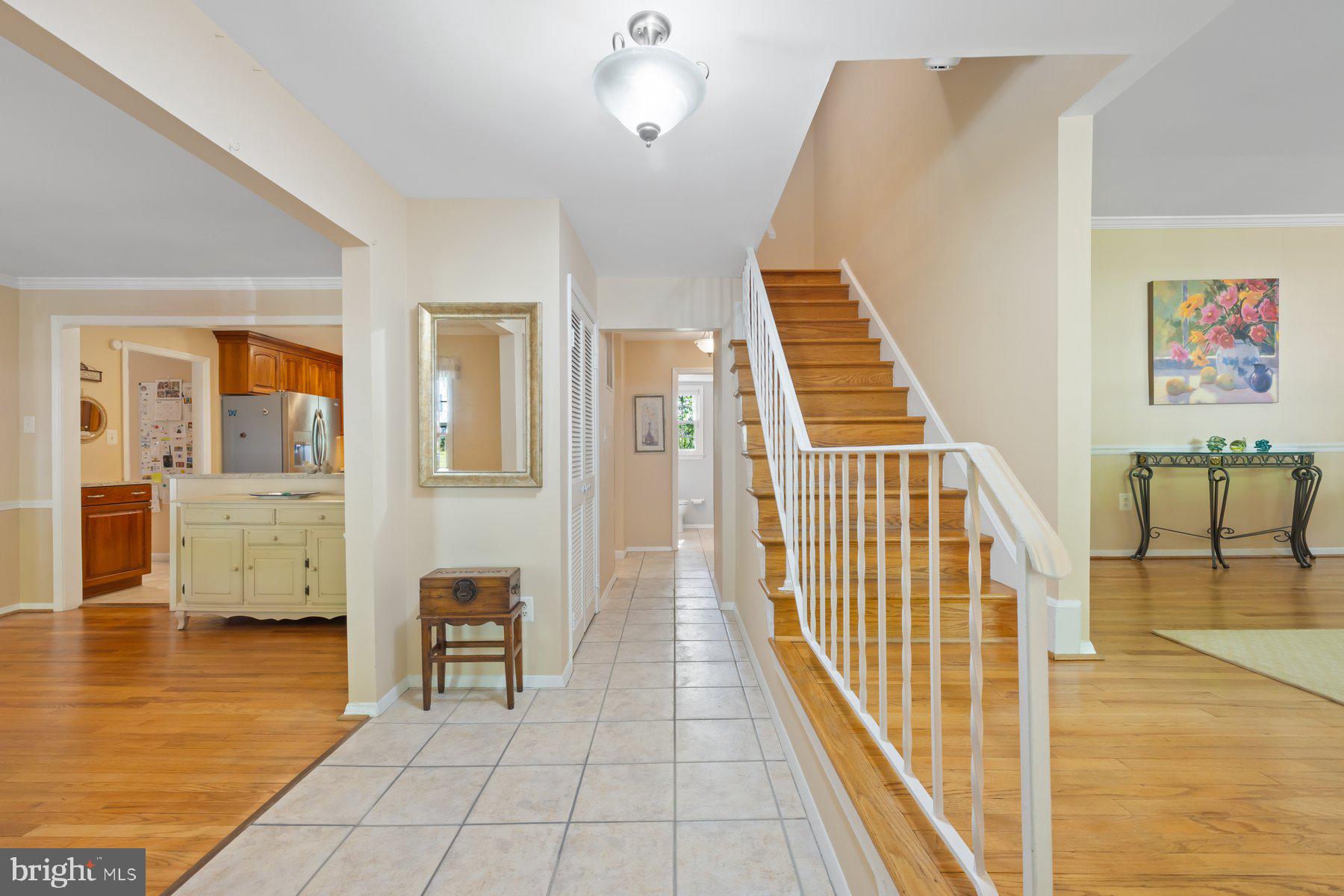 13820 Flint Rock Road Rockville, MD 20853 - Photo 7 of 50 a view of a hallway with wooden floor and staircase