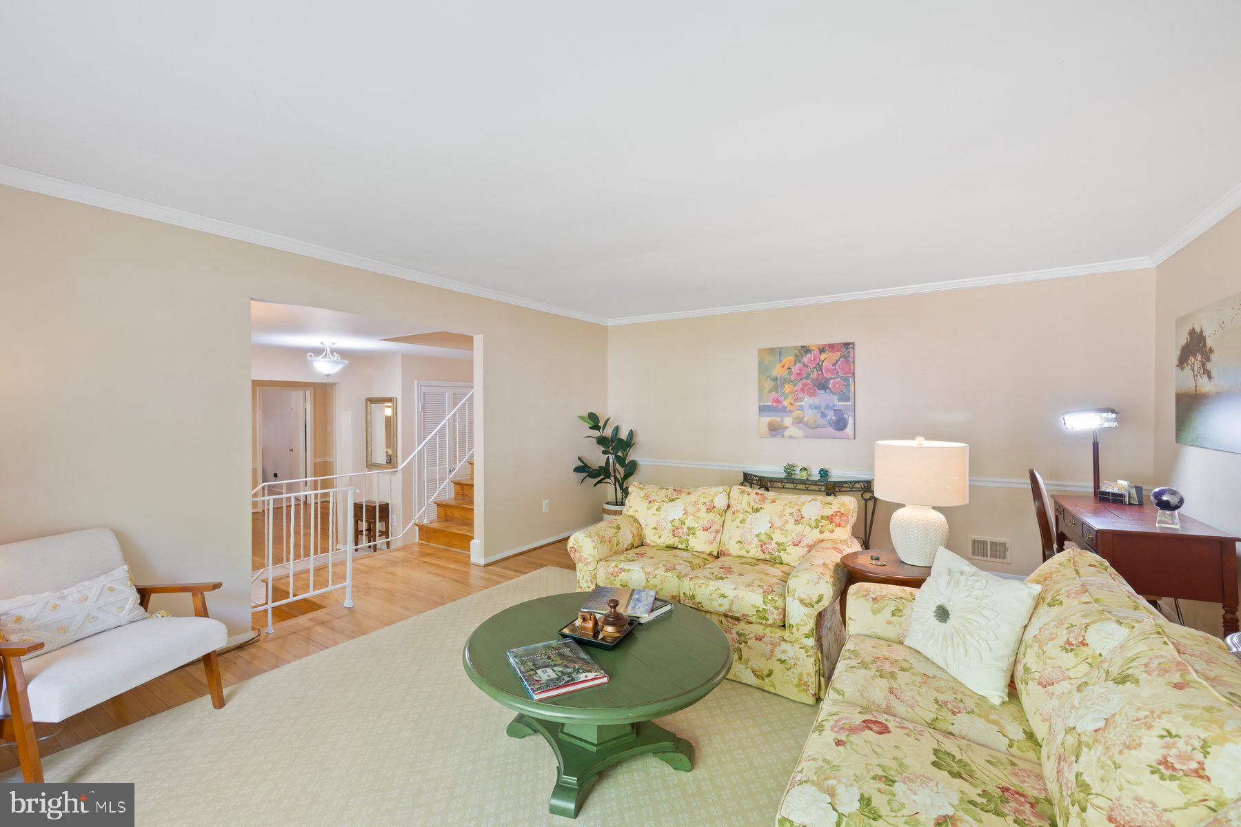13820 Flint Rock Road Rockville, MD 20853 - Photo 10 of 50 a living room with furniture and a wooden floor