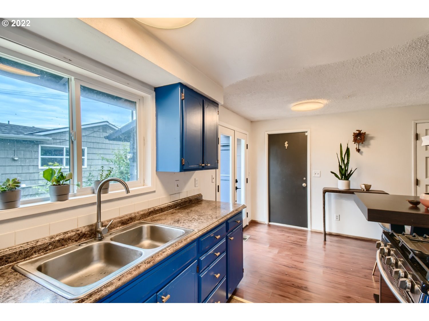 7109 North Sedro Street Portland, OR 97203 - Photo 13 of 28 a kitchen with granite countertop a sink and cabinets