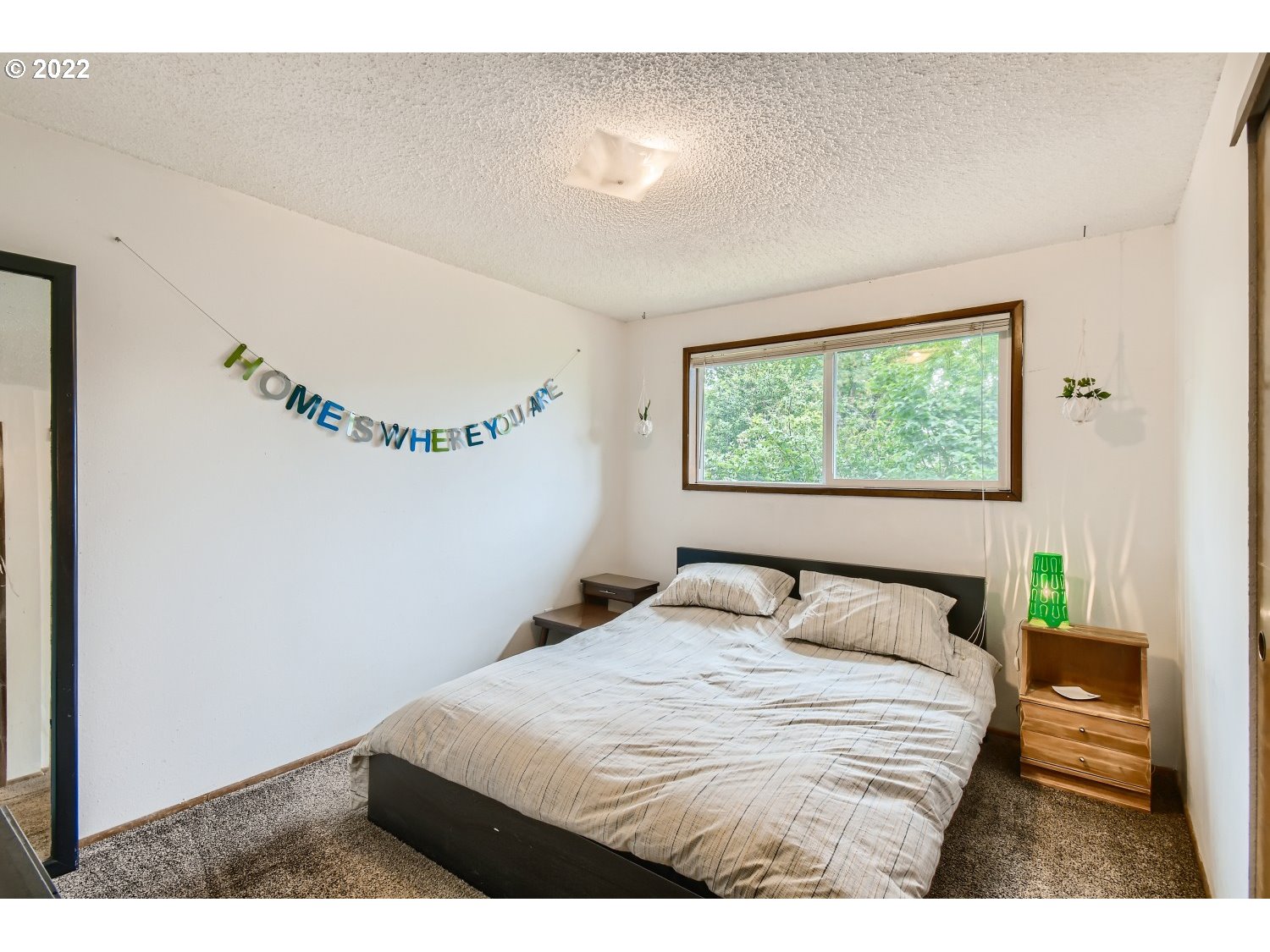 7109 North Sedro Street Portland, OR 97203 - Photo 15 of 28 a bedroom with a bed and a window
