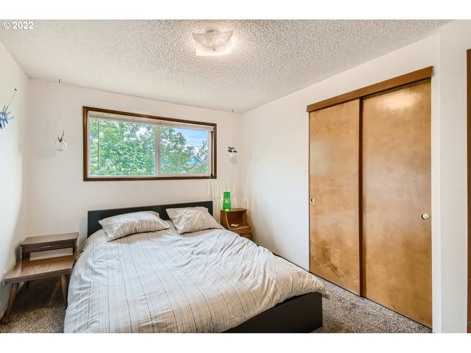 7109 North Sedro Street Portland, OR 97203 - Photo 16 of 28 a bedroom with a large window and bed