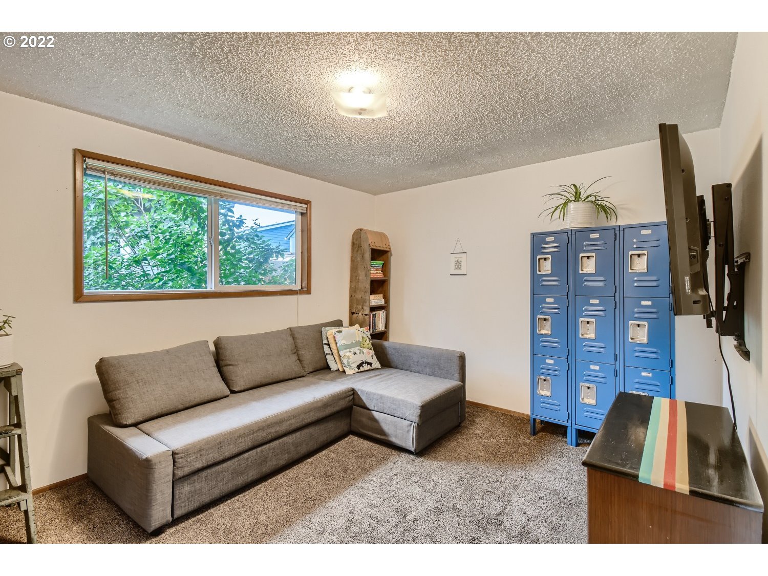 7109 North Sedro Street Portland, OR 97203 - Photo 21 of 28 a living room with furniture and a flat screen tv