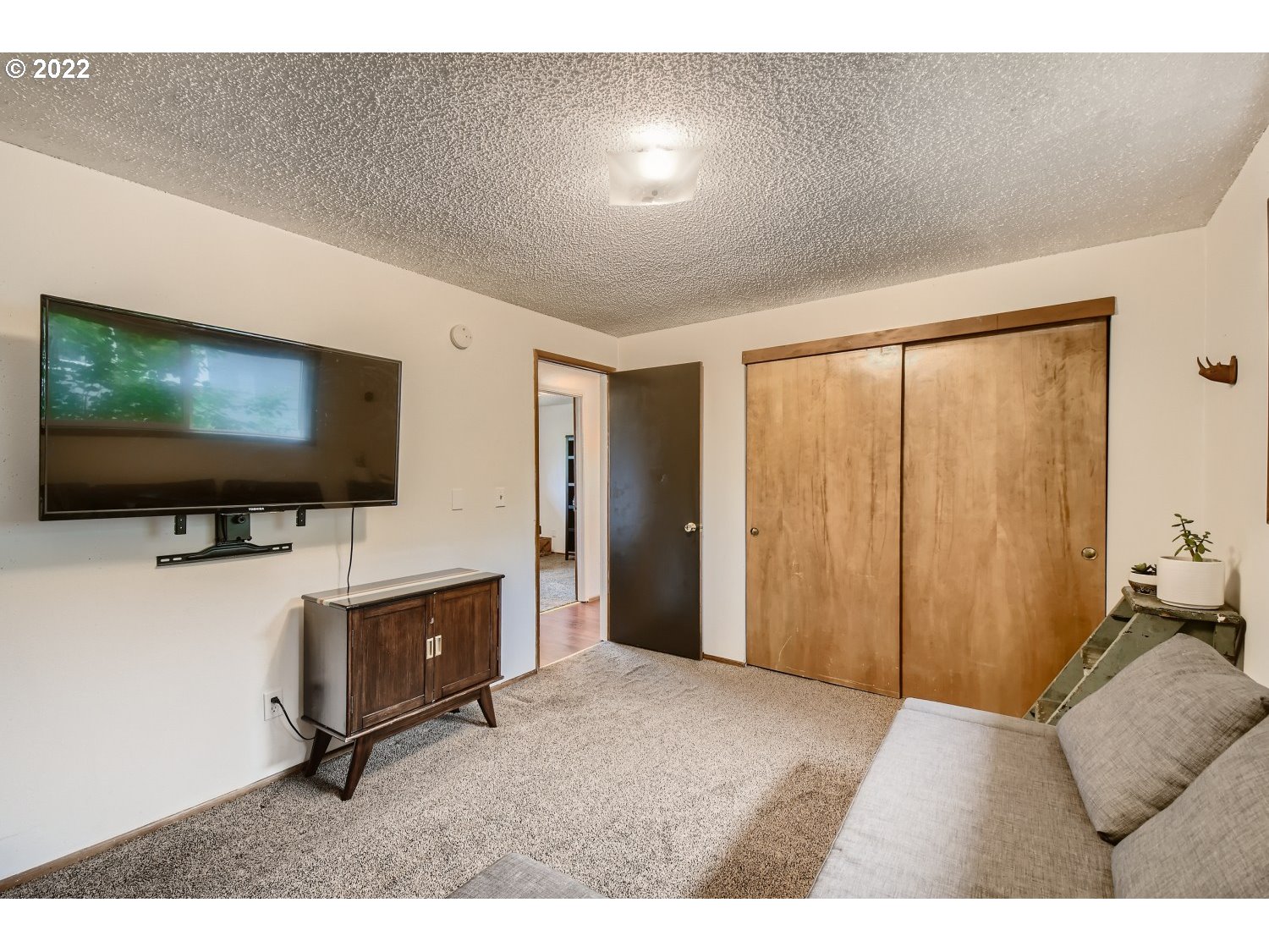 7109 North Sedro Street Portland, OR 97203 - Photo 22 of 28 a living room with furniture and a flat screen tv