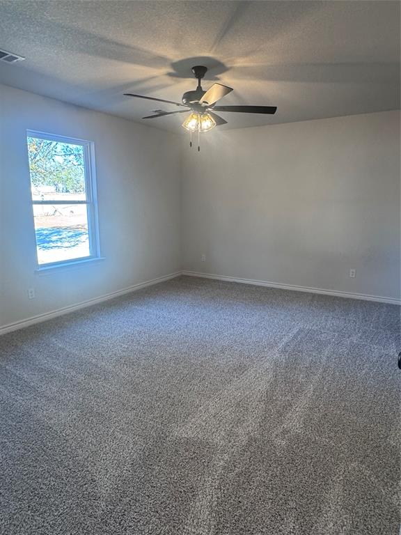 1009 East Bradshaw Road Springtown, TX 76082 - Photo 4 of 6 a view of an empty room with a window