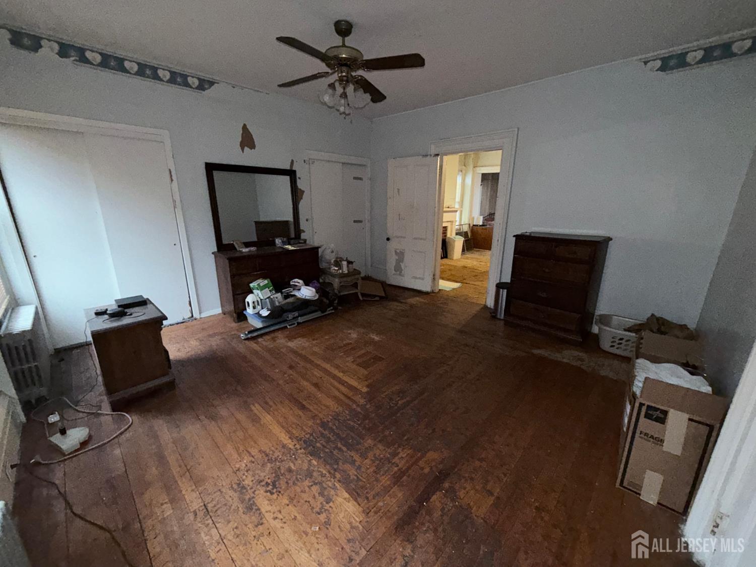 41 Atlantic Street Keyport, NJ 07735 - Photo 26 of 48 a living room with furniture and a flat screen tv