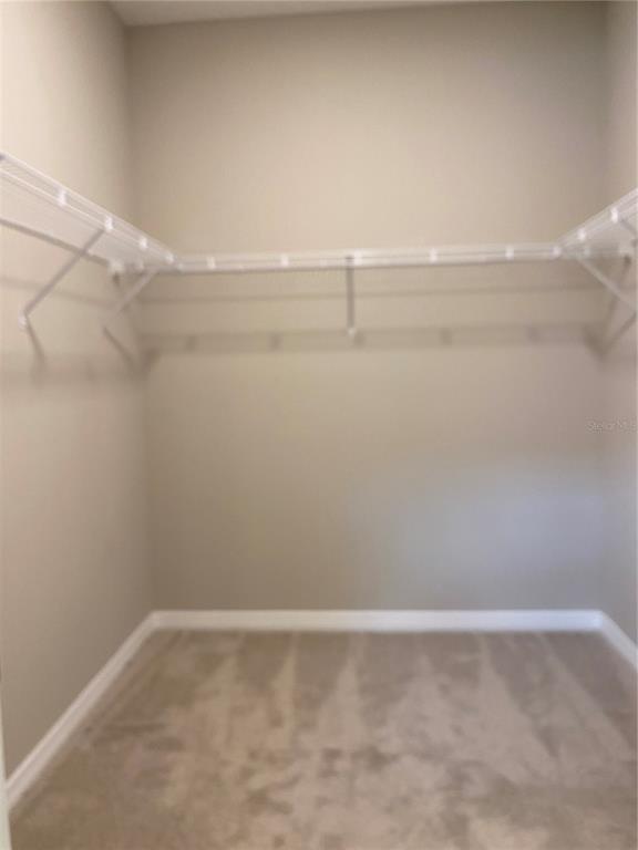 124 Soliera Street Nokomis, FL 34275 - Photo 17 of 43 a view of a room with racks on the wall