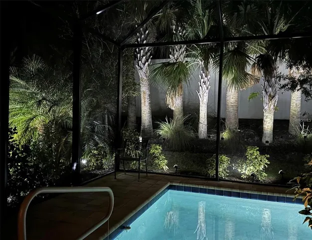 a view of a swimming pool with a table and chairs