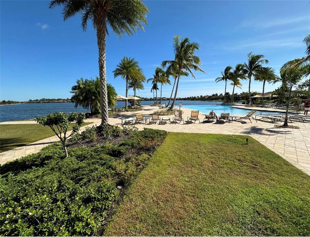124 Soliera Street Nokomis, FL 34275 - Photo 26 of 43 a view of a swimming pool with a table and chairs