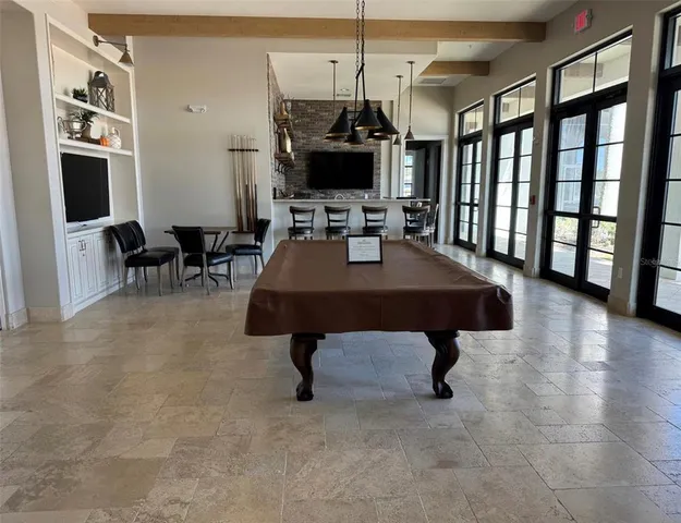a view of a chairs and table in the patio