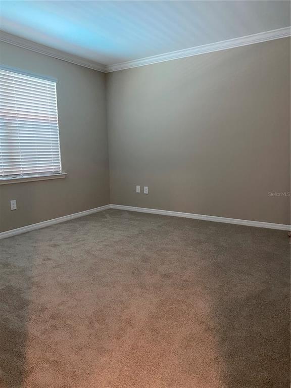 124 Soliera Street Nokomis, FL 34275 - Photo 5 of 43 an empty room with a window