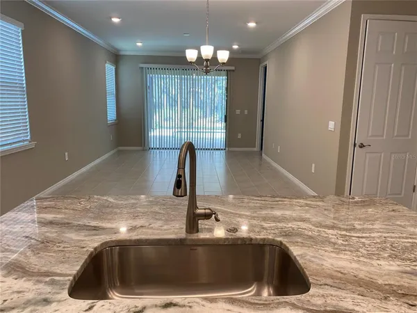 a kitchen with a sink and a vanity